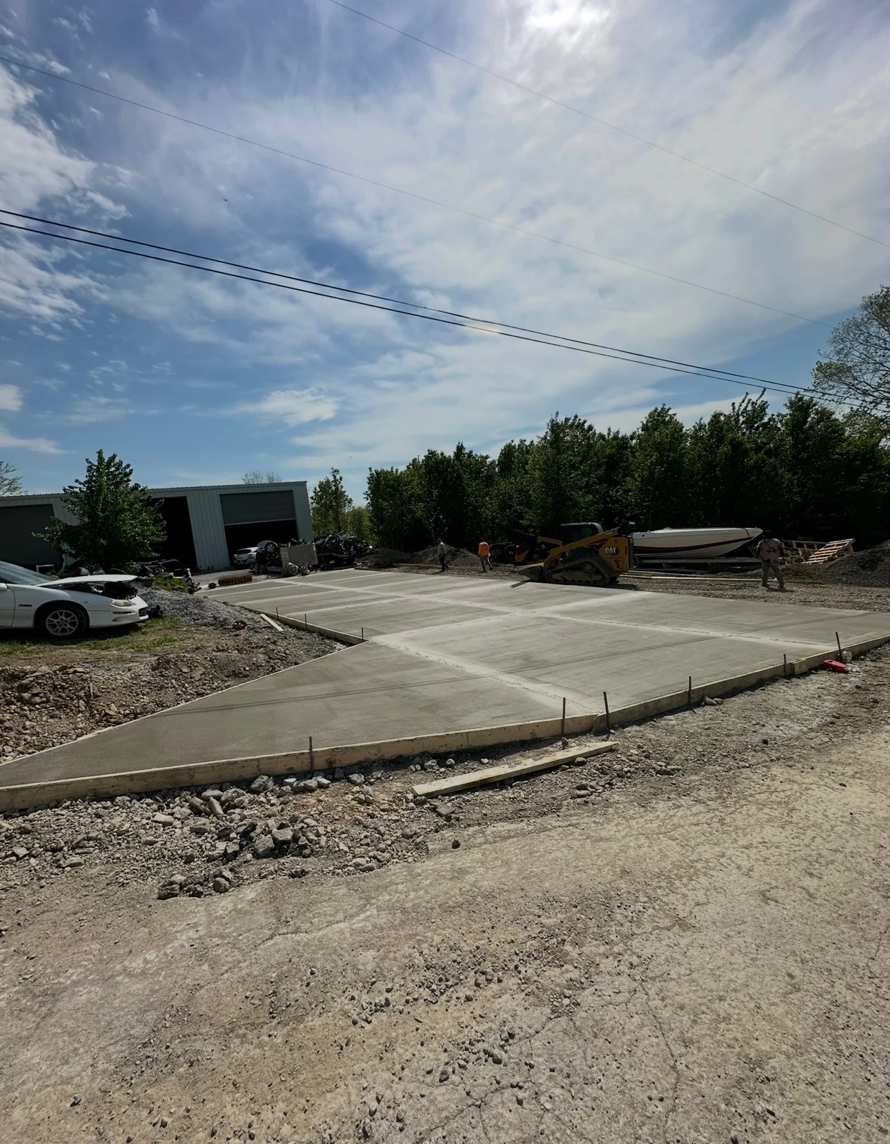 Newly poured concrete pad with control joints on commercial property in Lancaster