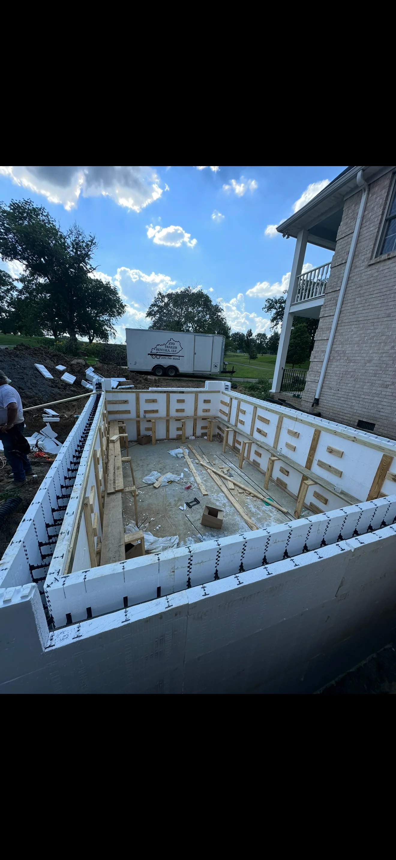 In-ground pool under construction with white foam insulation and wooden framing in Lancaster, KY